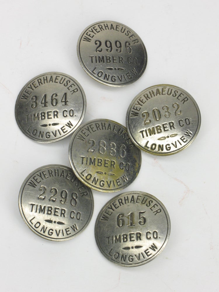 Item #5447 Weyerhaeuser Timber Co. Longview Numbered Employee Identification Badges [Lot of six]. Logging - Pacific Northwest.