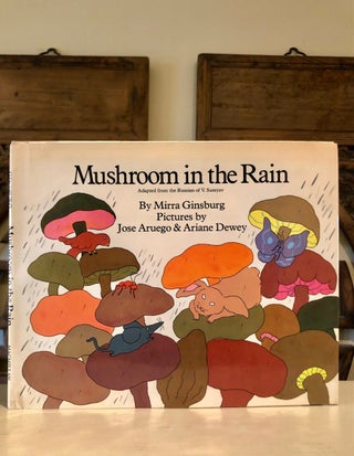 Item #6245 Review Copy with Dust Jacket: Mushroom in the Rain. Mirra V. Suteyev GINSBURG, adapted...